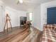 Spacious bonus room with vinyl flooring, light walls, a desk, an easel, and ample natural light at 905 Mount Olivet Rd, Kannapolis, NC 28083