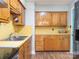 A quaint kitchen with retro cabinets, countertops, and stainless steel appliances at 905 Mount Olivet Rd, Kannapolis, NC 28083