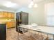 Kitchen with light blue walls, modern appliances, wood cabinets, and a large dining table for Gathering gatherings at 905 Mount Olivet Rd, Kannapolis, NC 28083
