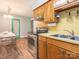 Kitchen with a stainless steel range, and a dining area with clear chairs at 905 Mount Olivet Rd, Kannapolis, NC 28083