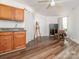This room showcases a sink, an easel, wood floors, and a desk near the armoire by the window at 905 Mount Olivet Rd, Kannapolis, NC 28083