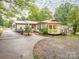 Inviting backyard features a gazebo and a well-maintained lawn, perfect for relaxing or entertaining at 905 Mount Olivet Rd, Kannapolis, NC 28083