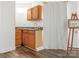 A small sink with cabinets is framed by a curtain and an easel with a picture in the background at 905 Mount Olivet Rd, Kannapolis, NC 28083