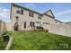 Spacious backyard featuring a well-kept lawn, patio area, and fenced perimeter for privacy at 9424 Avery Lilac Ln # 83, Fort Mill, SC 29707