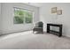 Bright bedroom features neutral walls, plush carpet, and a picturesque window view, creating a serene retreat at 9424 Avery Lilac Ln # 83, Fort Mill, SC 29707