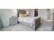 Bright bedroom boasts neutral walls, a comfortable bed, side tables and carpeted floors, creating an inviting space at 9424 Avery Lilac Ln # 83, Fort Mill, SC 29707