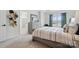 Bright bedroom features neutral walls, a comfortable bed, carpeted floors, and a window with a picturesque view at 9424 Avery Lilac Ln # 83, Fort Mill, SC 29707