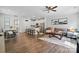 Open living space with hardwood floors, recessed lighting, and a modern kitchen with stainless steel appliances at 9424 Avery Lilac Ln # 83, Fort Mill, SC 29707