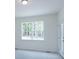 Bedroom with neutral walls, carpeting, and a large window with a view of the trees at Tbd Boomer Ct # 6, Statesville, NC 28677