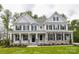Charming two-story home features stone accents, a covered porch, black shutters and manicured lawn at Tbd Boomer Ct # 6, Statesville, NC 28677