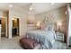 Comfortable bedroom features a plush bench, soft textures, and decorative wall flowers at Tbd Boomer Ct # 7, Statesville, NC 28677