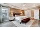 Spacious bedroom featuring a tray ceiling, accent wall, and stylish furniture, creating a relaxing retreat at Tbd Boomer Ct # 7, Statesville, NC 28677