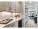 Elegant butler's pantry with custom cabinets, wine cooler, quartz countertops, and subway tile backsplash at Tbd Boomer Ct # 7, Statesville, NC 28677