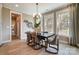 Sophisticated dining room with large windows, modern light fixture, and comfortable seating for six at Tbd Boomer Ct # 7, Statesville, NC 28677