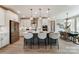 Bright, open kitchen featuring a large center island with pendant lighting and stainless steel appliances at Tbd Boomer Ct # 7, Statesville, NC 28677