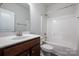 Bathroom featuring single sink vanity with tub and shower combo at 1030 Gardenia Dr # 2, Mt Ulla, NC 28125
