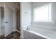 Modern bathroom features a soaking tub under a window with a separate glass enclosed shower at 1030 Gardenia Dr # 2, Mt Ulla, NC 28125