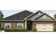 Charming single-story brick home with a two-car garage and neatly landscaped front yard at 1030 Gardenia Dr # 2, Mt Ulla, NC 28125