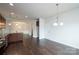 Spacious kitchen featuring granite countertops, stainless steel appliances, and dark hardwood flooring at 1030 Gardenia Dr # 2, Mt Ulla, NC 28125
