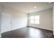 Living area featuring hardwood floors, recessed lighting, and a large window at 1030 Gardenia Dr # 2, Mt Ulla, NC 28125