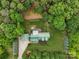 Aerial view of the log home showcasing its layout, roof, and surrounding landscaping at 10583 Earnhardt Lake Rd, Davidson, NC 28036