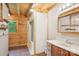 Comfortable bathroom with wood and white paneled walls, with shower stall and tiled floors at 10583 Earnhardt Lake Rd, Davidson, NC 28036