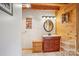 Well-lit bathroom featuring wood accents and vanity with storage at 10583 Earnhardt Lake Rd, Davidson, NC 28036