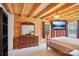 Comfortable log cabin bedroom with natural light and ample dresser storage at 10583 Earnhardt Lake Rd, Davidson, NC 28036