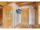 Well lit bedroom with wood floors, closet and mounted tv at 10583 Earnhardt Lake Rd, Davidson, NC 28036