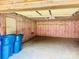Spacious garage with insulated walls, ladder, and overhead lighting, offering ample storage and workspace at 10583 Earnhardt Lake Rd, Davidson, NC 28036