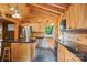 Well-equipped kitchen with stainless steel appliances and black countertops at 10583 Earnhardt Lake Rd, Davidson, NC 28036