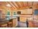 Charming kitchen with wood cabinets, black countertops, and modern appliances at 10583 Earnhardt Lake Rd, Davidson, NC 28036