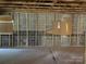 Basement with concrete floors and unfinished concrete block walls at 10625 Cool Springs Rd, Woodleaf, NC 27054