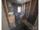 Bathroom with sink, toilet and exposed wall structure at 10625 Cool Springs Rd, Woodleaf, NC 27054