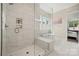 Modern bathroom featuring a large glass shower and a luxurious soaking tub at 11015 Benjamin Smith Ave, Huntersville, NC 28078