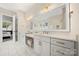 Well-lit bathroom with double vanity, modern fixtures, and a large mirror at 11015 Benjamin Smith Ave, Huntersville, NC 28078