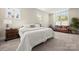 Cozy bedroom featuring neutral tones, carpeted floors, a sitting area and lots of natural light at 11015 Benjamin Smith Ave, Huntersville, NC 28078