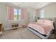 Charming bedroom featuring carpeted floors, pink curtains and lots of natural light at 11015 Benjamin Smith Ave, Huntersville, NC 28078