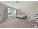 Bright bedroom featuring carpeted floors, a ceiling fan and lots of natural light at 11015 Benjamin Smith Ave, Huntersville, NC 28078