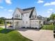 Long driveway leading to a beautiful home with a covered carport and well-maintained landscaping at 11015 Benjamin Smith Ave, Huntersville, NC 28078