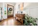 Stylish foyer with dark hardwood floors, decorative table, and a bright view to the porch at 11015 Benjamin Smith Ave, Huntersville, NC 28078