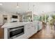 Kitchen island with stainless steel microwave and hardwood floors at 11015 Benjamin Smith Ave, Huntersville, NC 28078