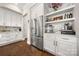Modern kitchenette with stainless steel appliances and open shelving at 11015 Benjamin Smith Ave, Huntersville, NC 28078