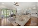 Spacious living room with a large sectional sofa and sliding glass doors to the patio at 11015 Benjamin Smith Ave, Huntersville, NC 28078