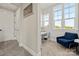 The office has carpet, a 'dream' sign, a desk and chair, and a blue couch at 11015 Benjamin Smith Ave, Huntersville, NC 28078