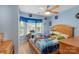 Bright bedroom with a large window, ceiling fan, and colorful décor at 130 Overcreek Rd, Mooresville, NC 28117