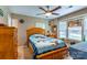 Comfortable bedroom with a ceiling fan and patterned walls, creating a cozy atmosphere at 130 Overcreek Rd, Mooresville, NC 28117