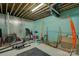 Unfinished basement with workout equipment, exercise accessories and suspended ceiling at 1306 Kings Bottom Dr, Fort Mill, SC 29715