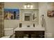 Stylish bathroom with marble countertops, decorative mirror, and modern fixtures at 1306 Kings Bottom Dr, Fort Mill, SC 29715