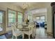 Bright breakfast nook featuring hardwood floors, large windows, and an open layout to the living area at 1306 Kings Bottom Dr, Fort Mill, SC 29715